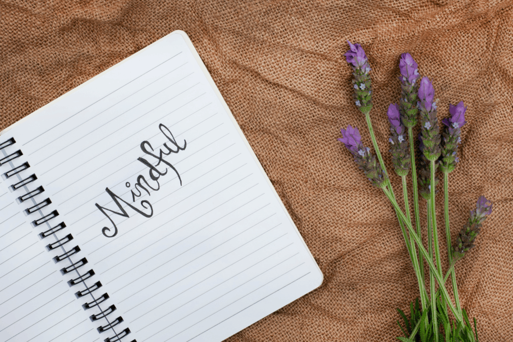 Mindfulness - the image shows lavender and a journal with mindful written on it